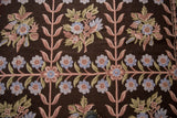 Curvilinear floral sprays and rhythmic trellis pattern on a vintage Chainstitch carpet.