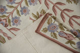 Vintage Chainstitch carpet folded, revealing curvilinear floral pattern and smooth cotton canvas backing.