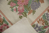 Vintage Chainstitch Carpet with curvilinear pink floral embroidery and beige cotton canvas backing.