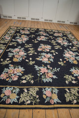 Low perspective across the vintage chainstitch carpet showing the rhythmic flow of floral sprays.