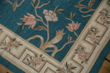 Textured curvilinear florals and geometric border on a vintage chainstitch rug.