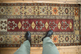 Full length view of the Turkish Melas runner, highlighting the geometric pinwheel and diamond patterns.