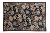 Vintage Chainstitch rug, black field with allover curvilinear floral design in blues, reds, and ivory.