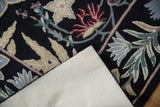 Vintage chainstitch carpet's curvilinear floral pattern in dusty tones with cotton canvas backing.