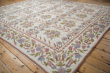 Detailed vintage Chainstitch carpet border with blush, blue floral sprays and scrolling vines.