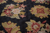 Textured chainstitch detail, showcasing floral sprays and geometric motifs in cherry red, saffron, black.