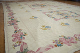 Vintage Chainstitch Carpet border detail featuring textured pink bows and colorful Savonnerie-inspired florals.
