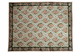 Vintage Chainstitch carpet with ivory field, pink and blue floral trellis, navy border.