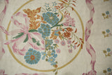 Spiraling ivory chainstitch texture with curvilinear pink ribbons and pastel floral motifs.