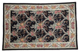 Vintage Chainstitch carpet, black field, raspberry, blush florals, ribbons, ivory border.