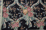Detail of chainstitch carpet: curvilinear pattern with pink roses and ribbon-tied floral sprays.
