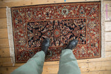 A person's-eye view of the vintage Armenian Hamadan rug, showing the rich color and scale underfoot.