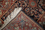 Folded corner of a vintage Hamadan rug reveals the dense wool pile and hand-knotted back.