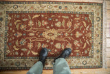 A standing perspective showing the scale and plush copper field of a vintage Lilihan design rug.