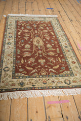 Angled view of a vintage Armenian Lilihan rug, highlighting its full pile and floral design.