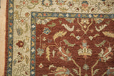 Close-up of the weaver's insignia on the copper field of a vintage Armenian rug.
