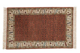 Vintage Armenian rug with a rust shadow-design field and a wide geometric ivory border with blue and brown accents.