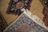 Intact ivory fringe and tightly woven foundation of a vintage Armenian Serab design rug.