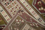 Hand-knotted construction and original side cord selvage on a vintage Turkish Melas rug corner.