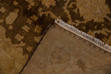 Tightly woven foundation and plush chocolate brown wool pile of a hand-knotted carpet.
