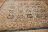 Peshawar carpet side selvage, border vines, palmettes, and field florals in dusty aqua and wheat.