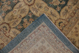 Peshawar carpet corner revealing dusty aqua floral pile, woven foundation, and intact teal selvage.