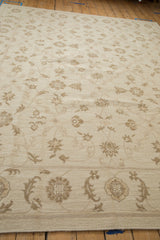Hand woven Indian Soumac carpet with ivory and beige Rococo floral arabesques.