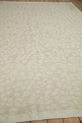 Tone-on-tone beige and ivory leaves in a playful random array on the hand woven Soumac carpet.