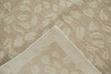 Contemporary Indian Soumac rug: beige leaf pattern, hand-woven foundation, and intact selvage.