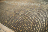 Hand knotted Indian abstract rug showing varied chocolate brown, gold, and ivory squares.