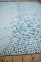 Intricate blue and ivory asymmetric squares on this modern abstract Indian carpet.