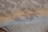 Peshawar rug's plush ivory pile showing subtle oxidized silver geometric lattice motif.