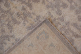 Peshawar rug corner: tone-on-tone silver ivory pile, geometric lattice back, and intact selvage.
