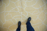 Abstract contemporary Soumac design showing fluid ivory outlines on pale saffron yellow.