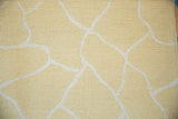 Hand-woven Soumac abstract carpet, textured ivory fluid lines on saffron yellow.