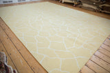 Contemporary Soumac carpet showing abstract fluid ivory animal print on saffron yellow.