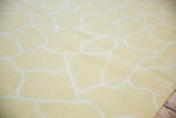 Fluid ivory outlines on the pale saffron yellow contemporary Soumac weave.