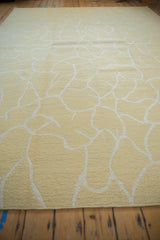 Hand woven contemporary Soumac rug: pale saffron yellow and ivory abstract pattern and intact selvage.