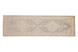 Peshawar rug runner featuring starburst floral medallions in muted ivory, silver, and dusty blue, 2'9