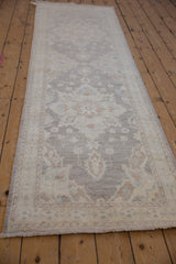 Hand-knotted Peshawar runner with ivory, pale coffee double starburst floral medallions.