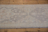 Peshawar Rug Runner's full, even pile with floral, quatrefoil motifs in light silver, ivory, blue.