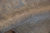 Hand-knotted Peshawar rug runner's plush, even pile texture in soft ivory and dusty blue.