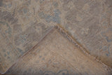 Peshawar rug's woven foundation, intact selvage, and plush silver-ivory pile.