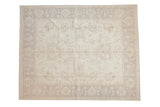 Ivory and pale beige Peshawar carpet with sprawling leaves, palmettes, and lotus border.