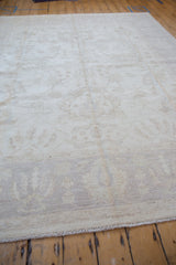 Even pile and subtle vinery on ivory, pale beige Peshawar carpet with intact selvage.