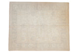 Traditional Peshawar carpet with subtle palmettes, lotus, and vinery in light neutral tones.
