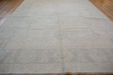 Hand knotted Peshawar carpet, subtle palmette and lotus floral vinery on light neutral field.