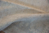 Hand-knotted foundation of the Peshawar carpet, revealing a tight weave and natural fibers.