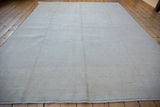 Rectangular Peshawar carpet displaying its even pile in a soft, neutral palette.