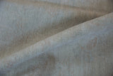 Full, plush pile texture of the Peshawar carpet in pale beige and ivory.